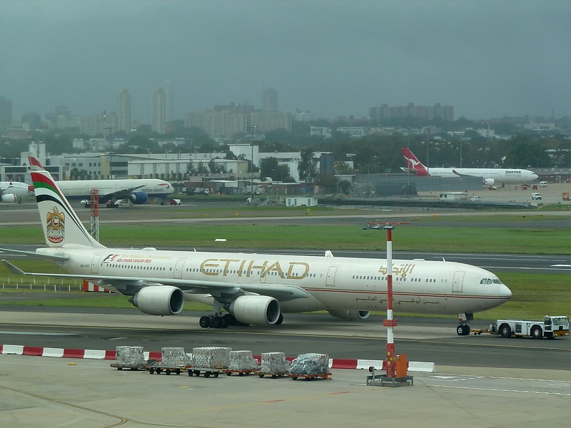 etihad inflight service cutback economy